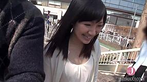 She removes her coat for an erotic shoot. Japanese beauty rides and fingers to climax