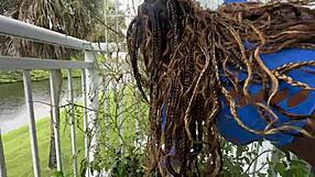Lucy hayz waters plants in bedroom