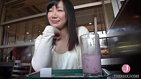 She removes her coat for an erotic shoot. Japanese beauty rides and fingers to climax