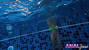 Asian girl rocks a big butt plug while swimming