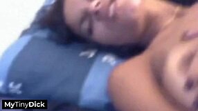 A beautiful black girl with natural breasts gives a good blow job to a small penis
