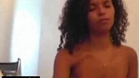 A beautiful black girl with natural breasts gives a good blow job to a small penis