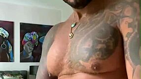 Tattooed Viktor Rom dances naked before masturbating his big black cock