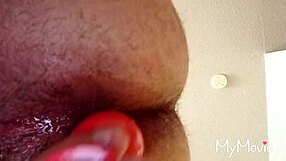 A gay man engages in anal play activities.