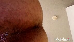 A gay man engages in anal play activities.