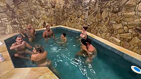 A kinky party with friends in a motel pool with an orgy