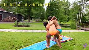 Teen lesbians in bikinis enjoy outdoor summer fun