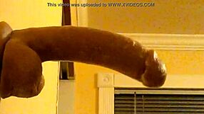 Gay guy in hood practices deepthroating a big dildo passionately