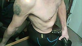 stretching session using massage gun in compression leggings and bound brace