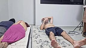 The wife chats with her roommate secretly, away from her husband.