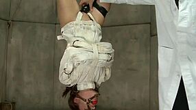 doctor punishes bound babe with anal toys