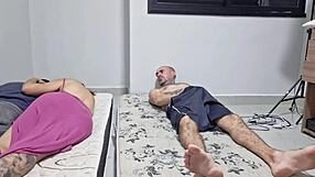 The wife chats with her roommate secretly, away from her husband.