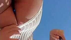 Young blonde’s transparent dress makes her almost naked outdoors