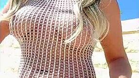 Young blonde’s transparent dress makes her almost naked outdoors