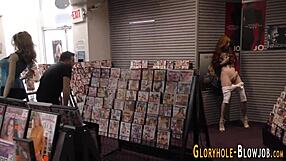 Redheaded Whore Sucks Huge Cock at Gloryhole