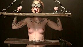 Redhead Shackled in Doggy Style Whipping and Gagging