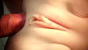 Close up of a shaved pussy being fucked in a hardcore scene