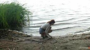 Teen redhead mia masturbates to wild orgasm by the lake