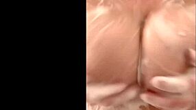 French mom caresses big tits in secret shower.