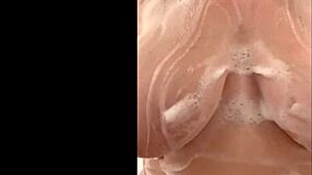 French mom caresses big tits in secret shower.
