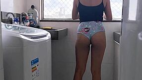 Sexy housewife flaunts her assets in short shorts at home