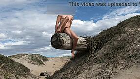 Nude athletic teasing with cock at public beach