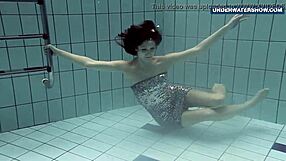 Russian beauty shows off her curves in a solo poolside striptease