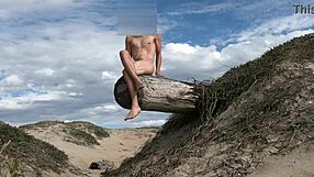 Nude athletic teasing with cock at public beach