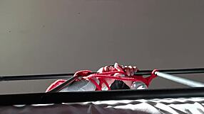 bound in latex, gagging on big cock