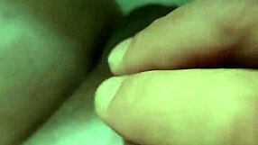 Close-up of a naked woman pleasuring herself in a car