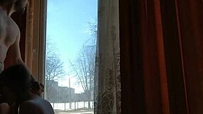 helga bosk takes risks by the window with people walking by