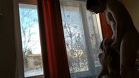 helga bosk takes risks by the window with people walking by