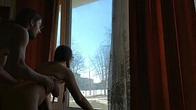 helga bosk takes risks by the window with people walking by