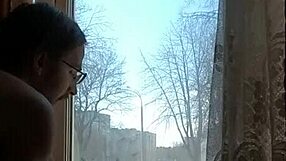 helga bosk takes risks by the window with people walking by