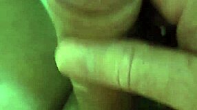 Close-up of a naked woman pleasuring herself in a car