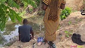 Outdoor babe enjoys black cock fucking in the garden river yard.