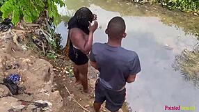 Outdoor babe enjoys black cock fucking in the garden river yard.