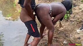 Outdoor babe enjoys black cock fucking in the garden river yard.