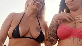 chatting dirty on beach with naughty friend before deflowering newbie