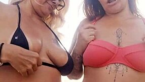 chatting dirty on beach with naughty friend before deflowering newbie