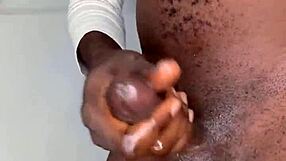 Ninja man strokes his monster cock and cums hard on himself.