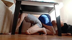 we sneak under the desk to rub our pussies while hiding from stepmother
