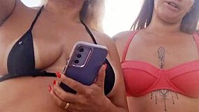 chatting dirty on beach with naughty friend before deflowering newbie