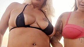 chatting dirty on beach with naughty friend before deflowering newbie