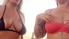 chatting dirty on beach with naughty friend before deflowering newbie