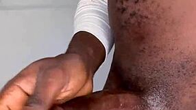 Ninja man strokes his monster cock and cums hard on himself.