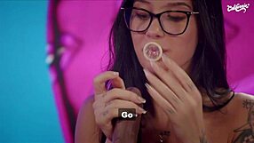 Passionate licking of tattooed brunette's shaved pussy