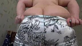 a woman attracts her partner with her figure and uses a toy