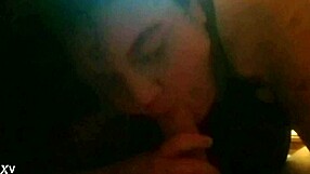 In this intimate scene, she eagerly sucks his cock with passion, taking it deep into her mouth while he watches closely.