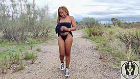 Ebony chick with big ass walks in sneakers, flashing her tits